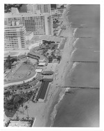 Aerial view of North Beach oceanfront hotels, hotel swimming pool, and buildings looking north