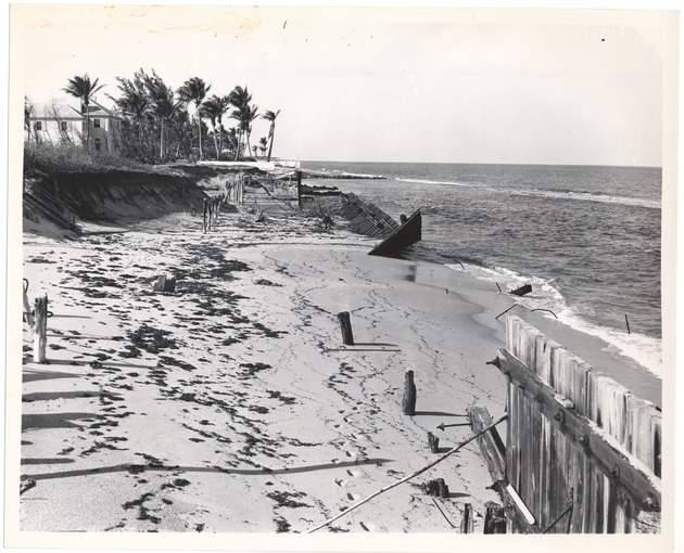 View of bulkhead failure and ocean front in an unknown location - Recto