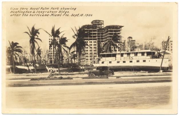 View thru Royal Palm Park showing Huntington and Inagraham Bldgs. after the hurricane - Postcard, recto: View thru the Royal Palm Park showing Huntington and Inagraham Bldgs. after the hurricane - Miami - Fla. Sept. 18. 1926.