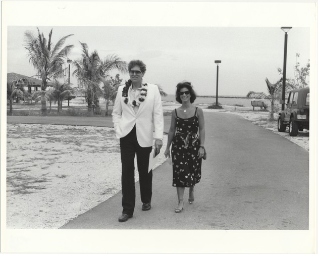 Miami Beach Mayors and commissioners at different events, 1980s - Photograph, recto: [View of Mayor Alex Daoud and wife walking at South Pointe Park, July 1986]