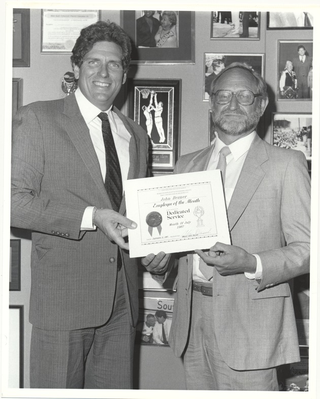 Miami Beach Mayor Alex Daoud presenting awards, 1986 and 1987 - Photograph, recto: [Alex Daoud presenting certificate for Dedicated Service to Employee of the Month Joh Brezner