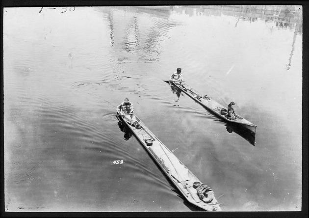 Seminole Indians with dugout canoes, 1920-1928 (bulk 1920) - 1. Two men and one dog in two canoes, 1920. no. 1-30.