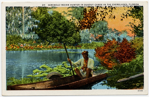 Seminole Indian Hunter in Dugout Canoe in the Everglades, Florida - Front