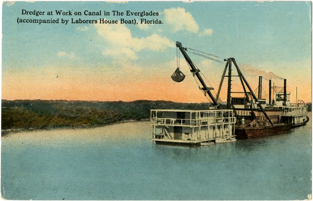 Dredger at work on canal in The Everglades (accompanied by laborers house boat), Florida - Front