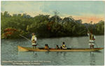 Seminole Indian family in dug-out canoe on Miami River, Florida."