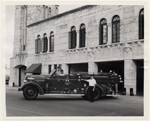 Firemen and fire truck in front of  Public Safety Building, Coral Gables, Florida