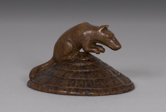Netsuke: fox mounted on straw hat and rat underneath - artifact front view