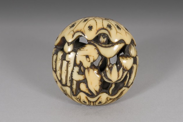 Ryusa netsuke: kappa and lotus blossoms - artifact front view