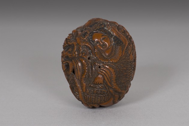 Netsuke: dragon and a lady - artifact front view