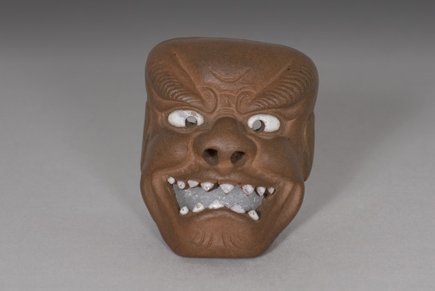Mask netsuke - artifact front view