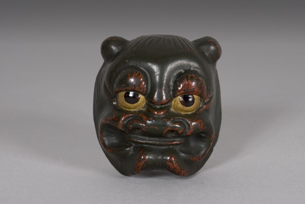Mask netsuke: grimacing Oni - artifact front view