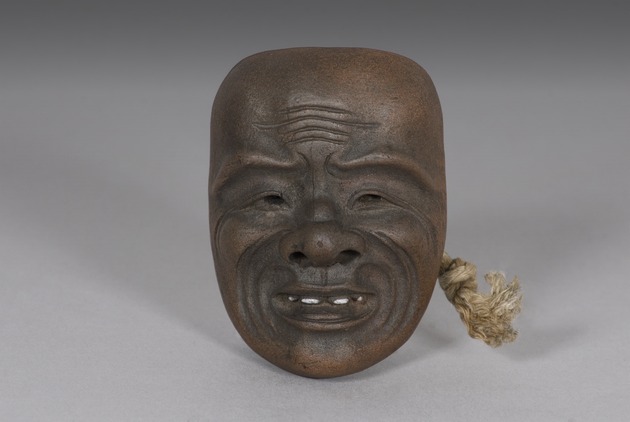 Mask netsuke of Okina - artifact front view