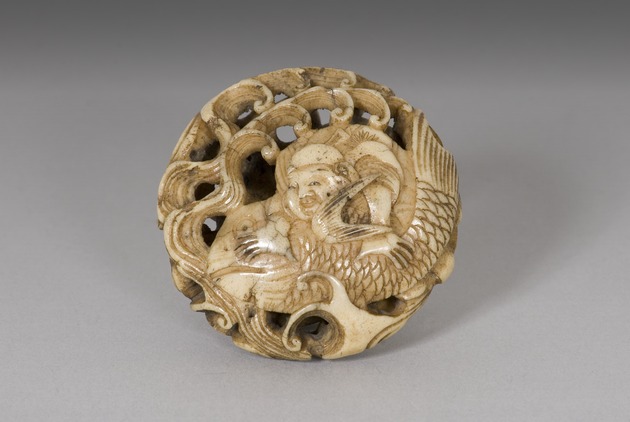 Ryusa netsuke: man riding fish - artifact front view