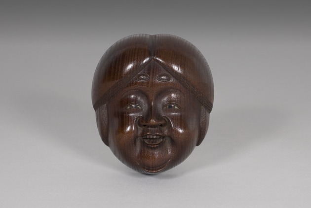 Mask netsuke of Okami - artifact front view