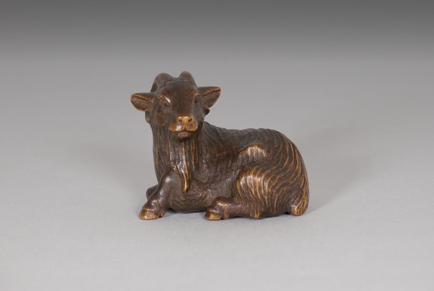 Netsuke: seated goat - artifact front view