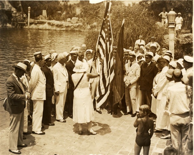 Mrs. Otto Herrmann, president of Miami German Woman's Club with officers of Dornier DO-X at the Venetian Pool. Coral Gables, Florida - Recto
