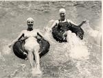 Two young women floating with inner tubes at the Venetian Pool. Coral Gables, Florida
