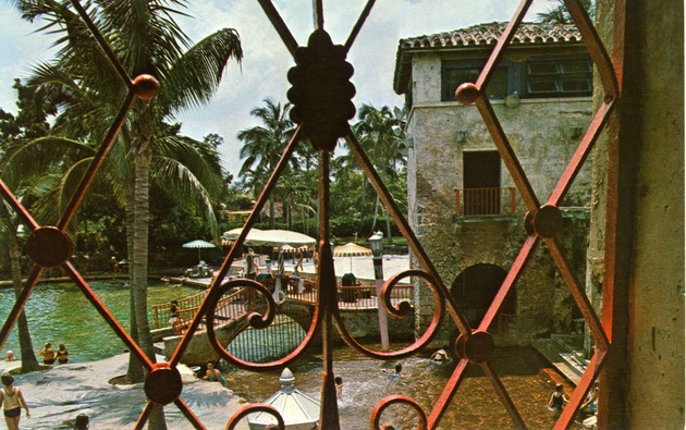 Venetian Pool seen through the bars of a window. Coral Gables, Florida - Recto