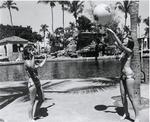 Young women playing with a beach ball at the Venetian Pool. Coral Gables, Florida