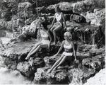 Three young women posing at the Venetian Pool. Coral Gables, Florida
