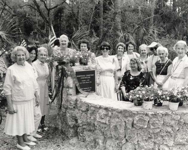 Group portrait of Daughters of the American Revolution next to the Pinewood Cemetery plaque. Coral Gables, Florida - Recto