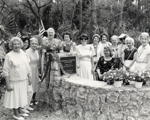 Group portrait of Daughters of the American Revolution next to the Pinewood Cemetery plaque. Coral Gables, Florida