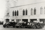 Firefighters posing on their fire trucks at Old Police and Fire Station Building. Coral Gables, Florida