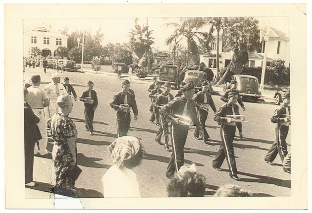 Miami Beach Drum and Bugle Corps, 1938, and the demolition of the Water Tower on First and Alton Road, 1997 - Photograph, recto: [View of the Miami Beach Drum & Bugle Corps on 1200 Block, Washington Avenue, November 11, 1938]