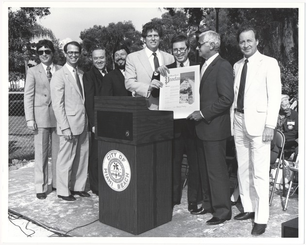 Mayor Alex Daoud with others presenting proclamation