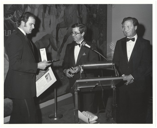 Miami Beach Mayor Fromberg and Commissioners presenting awards, July 1984 - Photograph, recto: [View of Mayor Malcom Fromberg presenting award to Juraslov Kubista]