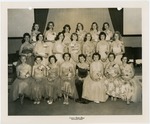 Group portrait of young women dressed up for prom night