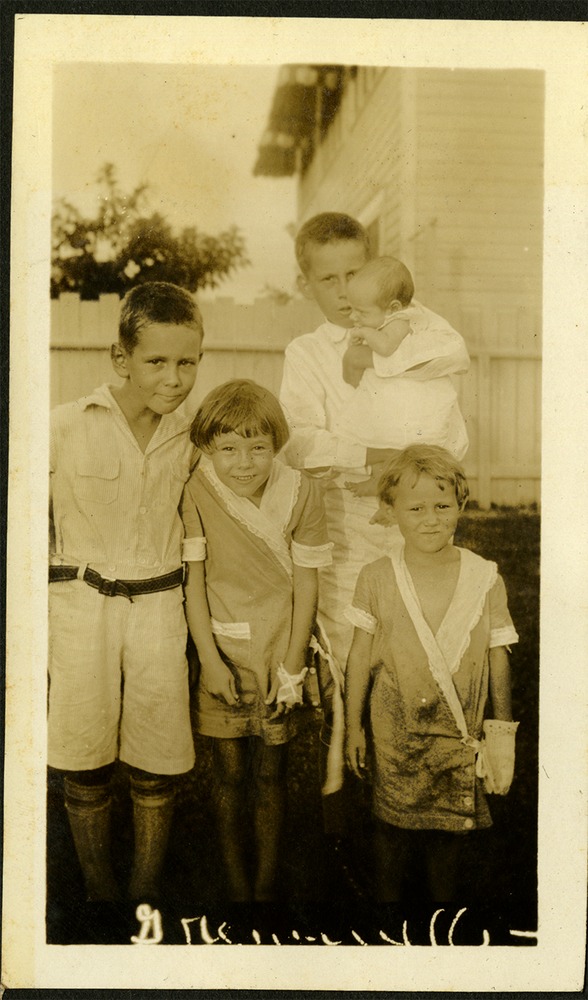 Greenville Family - Two girls and two boys, one of the boys is holding a baby