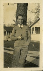 Jack Badger - Man with pipe leaning against tree