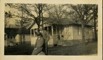Jack Badger - Man and woman posing in front of house