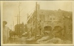 El Lorene Apts - Women in flooded street near damaged building