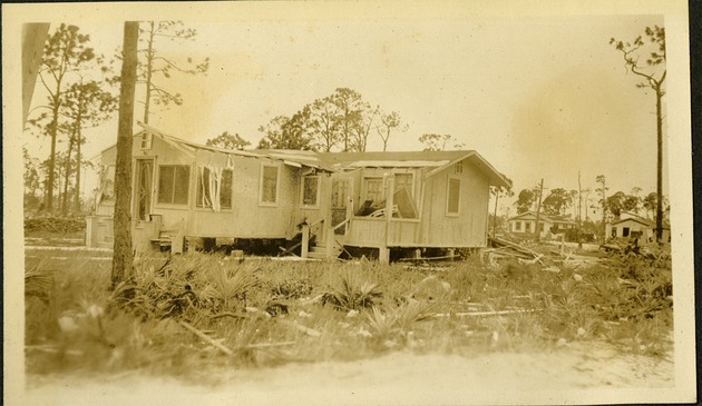 Old Home at 62nd St - Damaged home in field