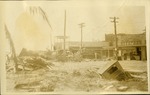 South Beach - note the car - Street near "Royal Palms" Car sunk in ground, hurricane debris
