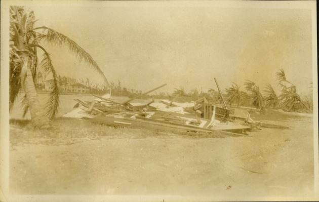 House on canal at beach  - hurricane debris - Flattened house near water