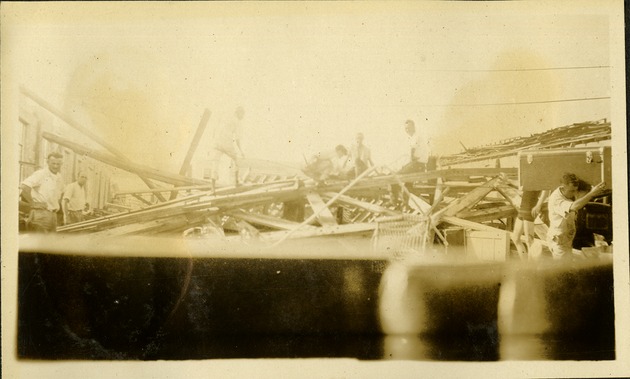 Hill Motor Co-Miami - destroyed store, men working