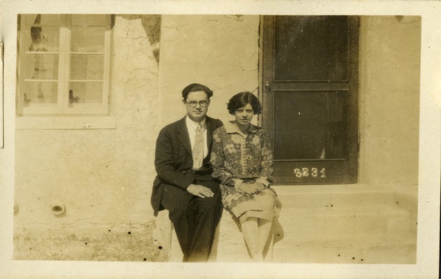 WAD [Walter Ashton Drummond and woman sitting near house]