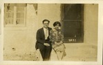 WAD [Walter Ashton Drummond and woman sitting near house]