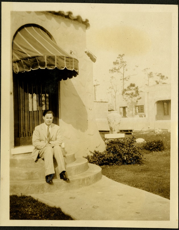 At home more or less! - man sitting on front steps of home