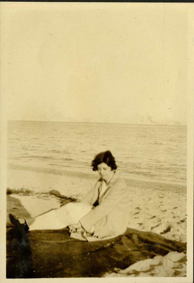 Lost - Woman sitting on sand