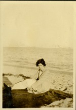 Lost - Woman sitting on sand