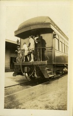 Group of people at back of train car