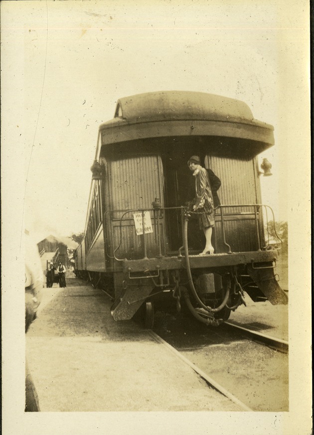Woman at back of train car
