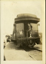 Woman at back of train car