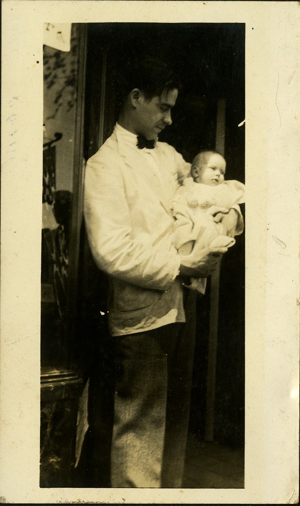 Man holding baby - Fritz Gibbon and baby Patsy