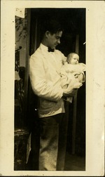 Man holding baby - Fritz Gibbon and baby Patsy