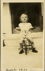 March 30 - Drew [Drew Healy]- Small child on bike in front of house steps